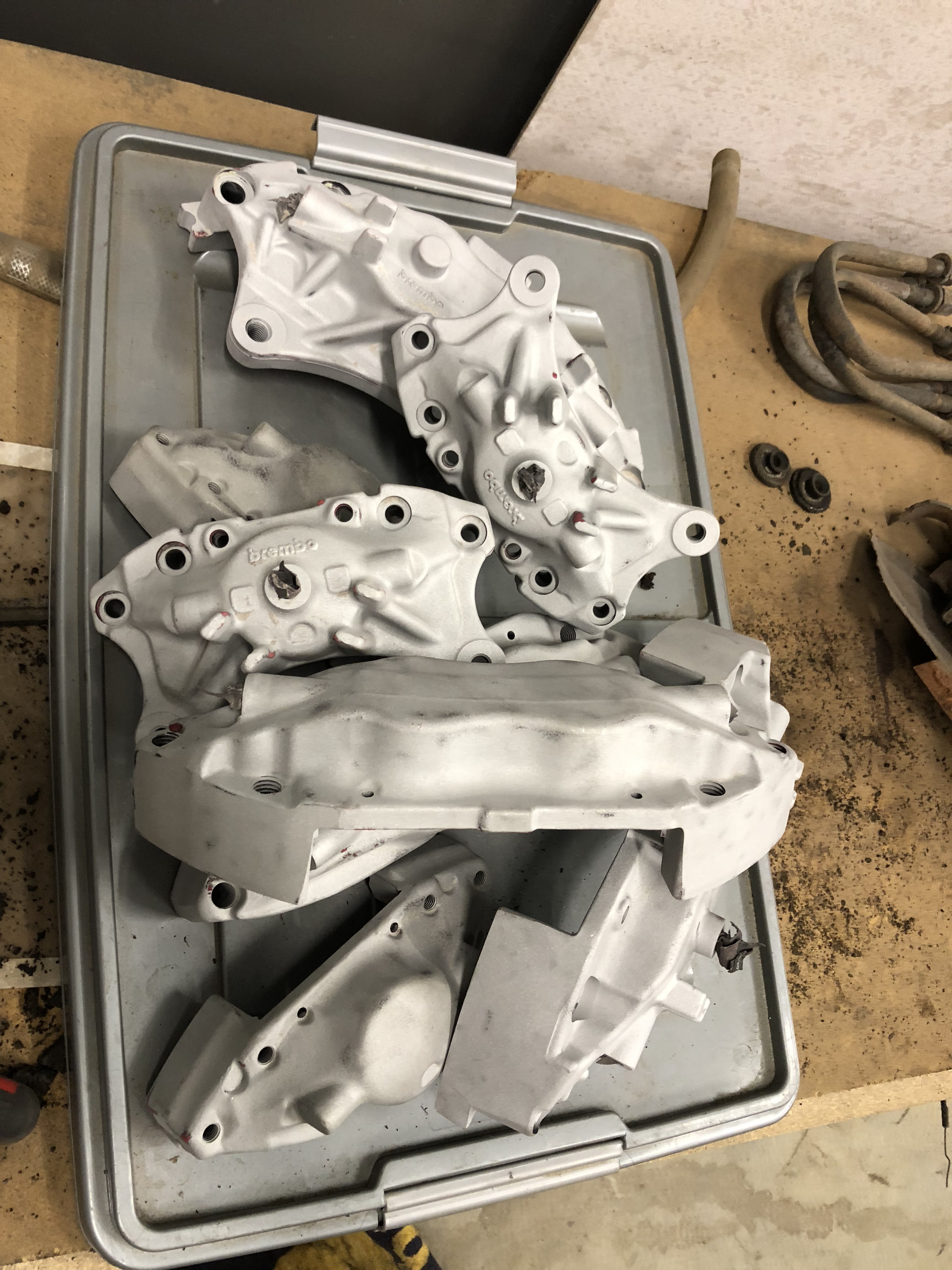 Multiple caliper sets stripped to bare metal